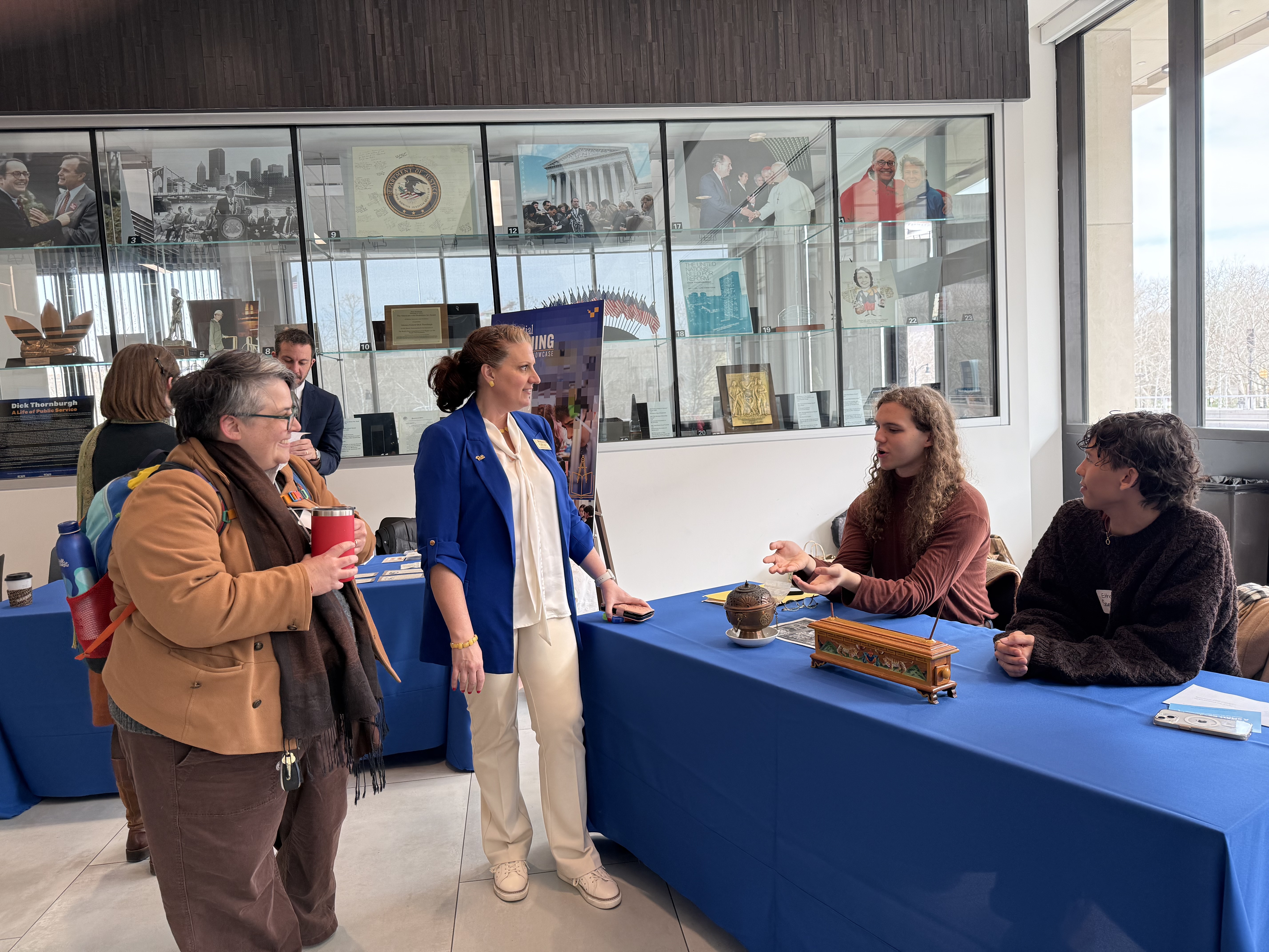 Students speak with event organizers